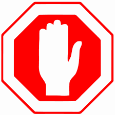 Hand giving the halt sign inside a stop sign